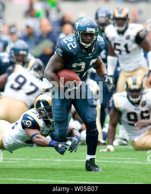 St. Louis Rams Marshall Faulk (L) congratulates Isaac Bruce after Bruce  scored a touchdown against the Seattle Seahawks in the first quarter at the  Edward Jones Dome in St. Louis on December