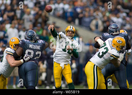 Green Bay Packers center Scott Wells holds his baby and the Vince