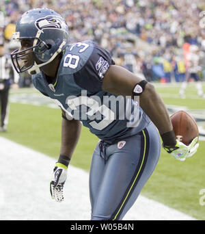 Seattle Seahawks wide receiver Deion Branch is tackled by New York Giants  safety Jason Bell after Branch made a catch in the first quarter of a NFL  football game Sunday, Sept. 24