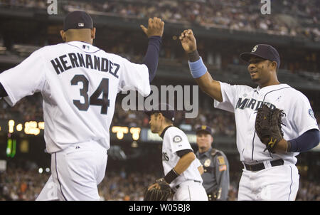 Seattle Mariners' Felix Hernandez, left, hugs manager Don Wakamatsu after  the baseball game against the New York Yankees Wednesday, June 30, 2010, at  Yankee Stadium in New York. Hernandez pitched a complete