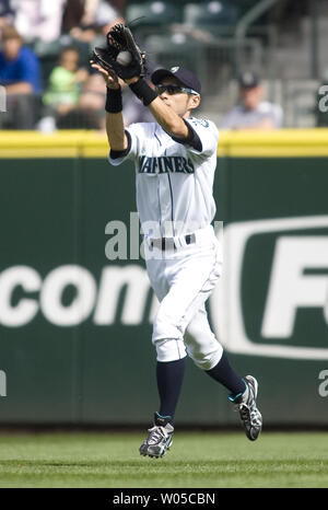 Seattle Mariners right fielder Ichiro Suzuki (R), playing for Japan in the  World Baseball Classic, speaks with Kosuke Fukudome (L) during practice for  Team Japan at Angel Stadium in Anaheim, California on