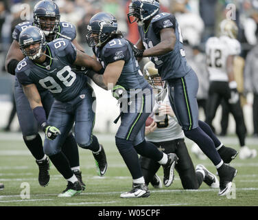 Seattle's Lofa Tatupu recovers a fumble by the 49ers in the second