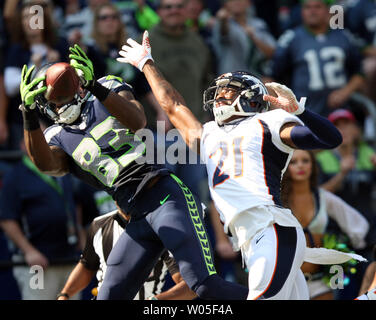 Seattle Seahawks wide receiver Ricardo Lockette (83) celebrates with  teammates, Doug Baldwin (89), Derrick Coleman (40) and Russell Wilson (3)  after catching a 39-yard touchdown pass from wilson against the Denver  Broncos