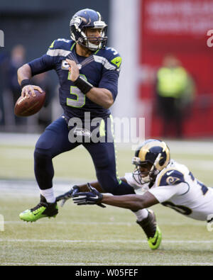 Oakland, California, USA. 17th Dec, 2006. St. Louis Rams defensive back  Ronald Bartell (24) runs with ball intended for Oakland Raiders wide  receiver Johnnie Morant (19) on Sunday, December 17, 2006, in