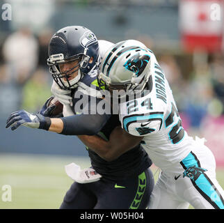 Seattle Seahawks tight end Jimmy Graham (88) brushes off a tackle by  Carolina Panthers outside linebacker A.J. Klein (56) at CenturyLink Field  in Seattle, Washington on December 4, 2016. Graham caught six