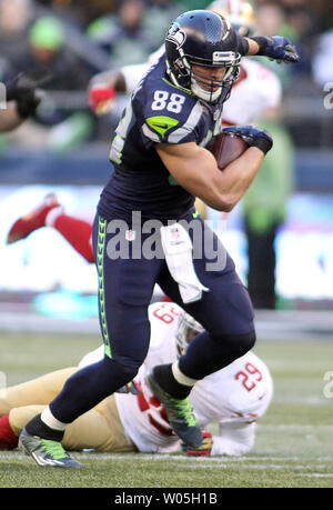 Seattle Seahawks tight end Jimmy Graham (88) brushes off a tackle by  Carolina Panthers outside linebacker A.J. Klein (56) at CenturyLink Field  in Seattle, Washington on December 4, 2016. Graham caught six