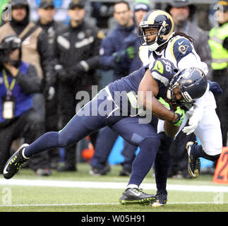 Seattle Seahawks running back Bryce Brown breaks a tackle by Cleveland  Browns defensive back Donte Whitner (31) at CenturyLink Field in Seattle,  Washington on November 29, 2015. The Seahawks clinched their fourth