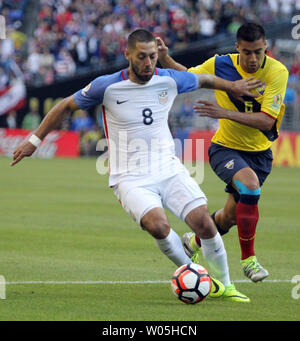 USA's Clint Dempsey (8) fends off  Ecuador's Juan Carlos Paredes (5) in a 2016 Copa America Centenario soccer quarterfinals at CenturyLink Field in Seattle, Washington on June 16, 2016.     Dempsey scored a first half goal in the USA 2-1 win over Ecuador to advance to the semi-finals.    Photo by Jim Bryant/ UPI Stock Photo
