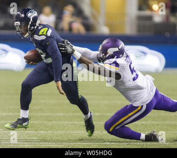 Seattle Seahawks quarterback Trevone Boykin (2) dives to score a two-point  conversion over Minnesota Vikings safety Jayron Kearse, right, in the  second half of a preseason NFL football game, Thursday, Aug. 18