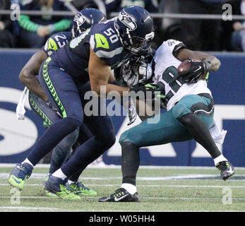 Philadelphia Eagles running back Wendell Smallwood (28) hurdles over  teammate Jason Kelce (62) during second quarter action against the Los  Angeles Chargers at StubHub Center in Carson, California on October 1, 2017.