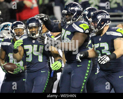 Seattle Seahawks center Joey Hunt (62) and offensive tackle Jalen McKenzie  (76) run a drill during the NFL football team's training camp, Wednesday,  Aug. 9, 2023, in Renton, Wash. (AP Photo/Lindsey Wasson