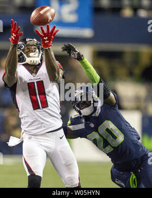Atlanta Falcons wide receiver Julio Jones (11) hauls in a pass for a 21-yard gain against Seattle Seahawks cornerback Jeremy Lane (20) in the second quarter at CenturyLink Field in Seattle, Washington on November 20, 2017. The Atlanta Falcons hang on to beat the Seattle Seahawks 34-31 in Seattle.  Photo by Jim Bryant/UPI Stock Photo