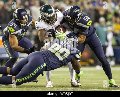 Seattle Seahawks defensive end Quinton Jefferson (99) and Seattle Seahawks  defensive tackle Jarran Reed (90) stops Minnesota Vikings running back  Dalvin Cook (33) for a one yard game during the fourth quarter