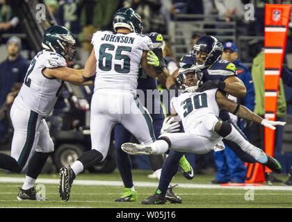 Philadelphia Eagles running back Corey Clement (30) is tackled by