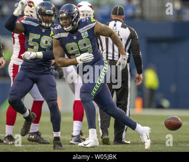 Seattle Seahawks defensive end Quinton Jefferson (99) celebrates with linebacker Jake Martin (59) after recovering a fumble by Arizona Cardinals quarterback Josh Rosen during the third quarter at CenturyLink Field on December 30, 2018 in Seattle, Washington.  Seattle Seahawks beat the Cardinals 27-24.  Photos by Jim Bryant/UPI Stock Photo