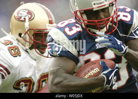 Wide receiver Deion Branch (84) of the New England Patriots takes video of  the scene during the AFC Champions' Media Day session at Lucas Oil Stadium  for Super Bowl XLVI on Tuesday