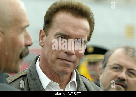 Governor Arnold Schwarzenegger listens to local firefighters while participating in the annual Golden Guardian Exercise emergency preparedness disaster drill that was held on Treasure Island in San Francisco on November 16, 2006. (UPI Photo/Aaron Kehoe) Stock Photo