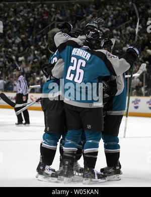 The San Jose Sharks including Steve Bernier (26) celebrate after Ryane Clowe scored the Sharks second goal in the second period against the Nashville Predators during game three of the Western Conference quarterfinals at the HP Pavilion in San Jose, California on April 16, 2007. (UPI Photo/Aaron Kehoe) Stock Photo