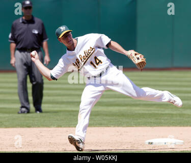 Oakland Athletics second baseman Mark Ellis throws the ball to first after fielding a ground ball during the fifth inning against the Seattle Mariners at McAfee Coliseum in Oakland, California on July 8, 2007. (UPI Photo/Aaron Kehoe) Stock Photo