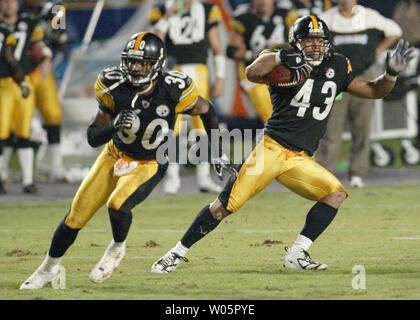 Pittsburgh Steelers Strong Safety Troy Polamalu (43) tackles Miami Dolphins  Tight End Randy McMichael (81) during a second quarter downpour on  September 26, 2004 at Pro Player Stadium in Miami, Fl. The