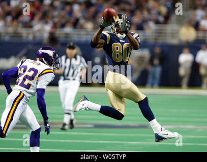 Former St. Louis Rams Isaac Bruce holds the Super Bowl trophy during  ceremonies celebrating the teams Super Bowl victory in the 1999-2000  season, at the Edward Jones Dome during half time of