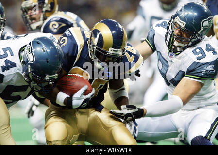 St. Louis Rams Marshall Faulk (L) congratulates Isaac Bruce after Bruce  scored a touchdown against the Seattle Seahawks in the first quarter at the  Edward Jones Dome in St. Louis on December