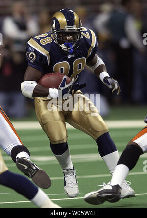 St. Louis Rams Marshall Faulk (L) congratulates Isaac Bruce after Bruce  scored a touchdown against the Seattle Seahawks in the first quarter at the  Edward Jones Dome in St. Louis on December