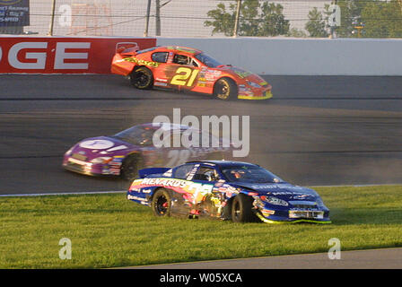 NASCAR Busch series driver Clint Bowyer (21)  of Emporia, KS, hits the wall while Travis Geisler (36) of Cranberrry Township, PA finds the infield during a crash in turn three of the third lap of the Charter 250 race at Gateway International Raceway in Madison, IL. on May 8, 2004. Mark Green (28) of Owensboro, KY passed through the accident without incident. Both cars remained in the race.(UPI Photo/Rob Cornforth) Stock Photo