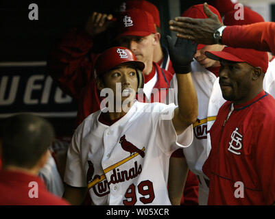 St. Louis Cardinals' So Taguchi is congratulated by third base