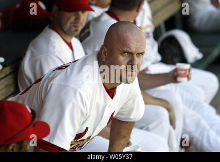 Newly aquired outfielder Larry Walker walks into the St. Louis Cardinals  dugout for the first time during a game with the New York Mets at Busch  Stadium in St. Louis on August