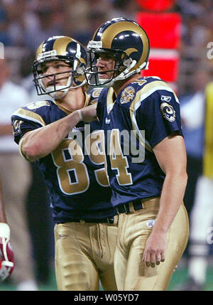 St. Louis Rams Dane Looker (L) congratulates place kicker Jeff Wilkens after the first field goal of the day against the Arizona Cardinals in the second quarter at the Edward Jones Dome in St. Louis on September 12, 2004. That field goal made Wilkens the Rams all-time scoring leader. (UPI Photo/Bill Greenblatt) Stock Photo