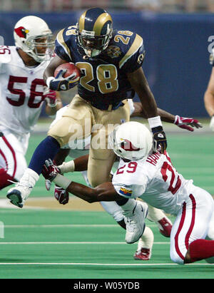 St. Louis Rams Marshall Faulk watches the action from the