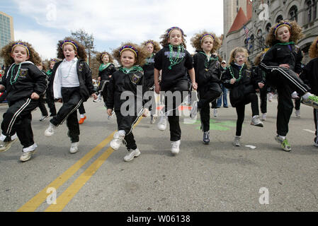 Young dancers from the Graham Dance Academy perform Irish dance as they make their way down Market Street during the St. Patrick's Day Parade in St. Louis on March 12, 2005. (UPI Photo/Bill Greenblatt) Stock Photo