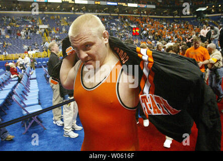 Heavyweight wrestler Steve Mocco of Oklahoma State puts on a warmup top as he leaves the ring after defeating  Minnesota's Cole Konrad in the 2005 NCAA Division 1 Wrestling Championships at the Savvis Center in St. Louis, on March 19, 2005. The match went into an overtime period with Mocco coming out on top with a takedown resulting in a score of 3-1.  (UPI Photo/Bill Greenblatt) Stock Photo