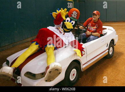 St. Louis Cardinals mascot Fredbird, top, high-fives a group of elementary  school children after they sang the national anthem prior to a baseball  game between the Cardinals and the Detroit Tigers, Sunday