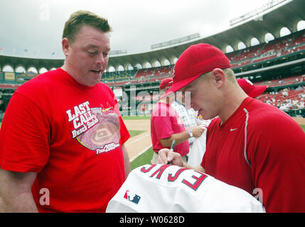 St. Louis Cardinals Bill DeWitt III gets a closer look at the new team uniform  jersey at Busch Stadium in St. Louis on November 16, 2012. For the first  time in 80