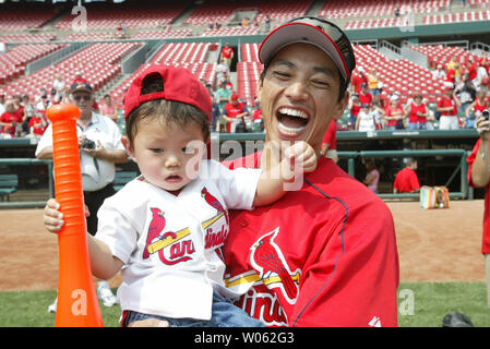 St. Louis Cardinals outfielder So Taguchi plays with his family