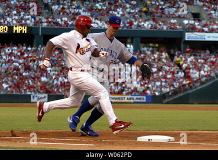 Chicago Cubs pitcher Mark Prior grimaces as he sits on the infield after  being hit on his pitching arm by a line drive off the bat of Colorado  Rockies outfielder Brad Hawpe