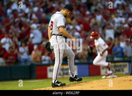 Atlanta Braves pitcher John Smoltz points towards catcher Greg Olson after  the Braves defeated the Pittsburgh Pirates, 4-0, to win Game 7 of the  National League playoffs at Three Rivers Stadium in