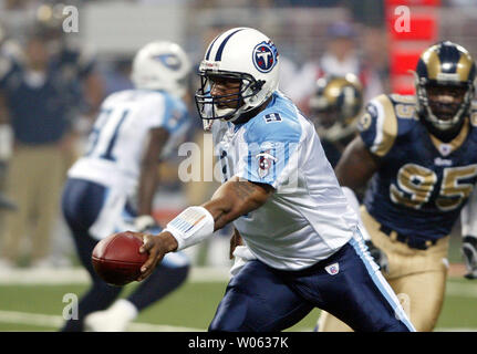 Tennessee Titans quarterback Steve McNair uses a towel to escape some of  the rain during practice on Thursday, Sept. 16, 2004, in Nashville, Tenn.  McNair will face his co-MVP partner in Indanapolis