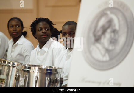 Members of the Beaumont High School Band listen to ceremonies honoring the life of Rosa Parks, in St. Louis on December 1, 2005. Programs honoring the life of Rosa Parks were held nationwide on the 50th anniversary of the day Parks was arrested for not giving up her seat on a city bus to a white man in Mongomery, AL in 1955. (UPI Photo/Bill Greenblatt) Stock Photo