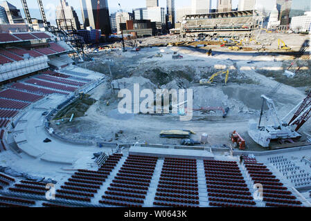 Demolition on the old Busch Stadium continues while construction on the new facility (foreground) moves ahead in St. Louis on December 5, 2005. The new $400 million stadium is expectred to be ready by opening day, April 10, 2005.   (UPI Photo/Bill Greenblatt) Stock Photo