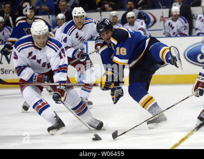 St. Louis Blues Mike Sillinger (18) is upended by New York Rangers Dominic Moore in the first period at the Savvis Center on December 10, 2005.   (UPI Photo/Bill Greenblatt) Stock Photo