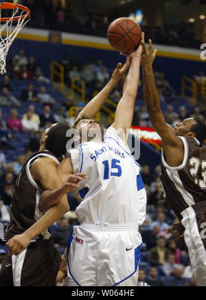 Saint Louis University Billikens Ian Vouyoukas (15) battles St. Bonaventure Bonnies' Paul Williams (L) and Wade Dunston (R) for the rebound in the first half at the Savvis Center in St. Louis on January 3, 2006. (UPI Photo/Bill Greenblatt) Stock Photo