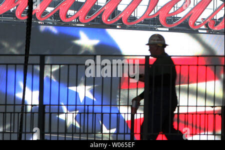 A construction worker walks on the upper terrace as electricians work on the scoreboard at the new Busch Stadium in St. Louis on March 16, 2006. The Cardinals will play their first game in the new facility on April 10. (UPI Photo/Bill Greenblatt) Stock Photo