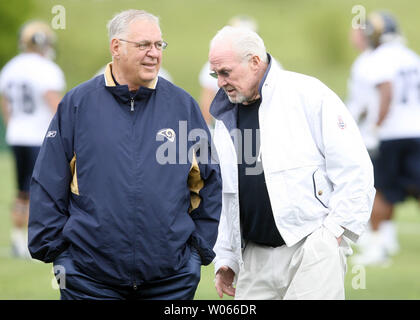 St. Louis Rams general manager Charlie Armey (L) talks with former offensive line coach Jim Hannifan during a rookie minicamp at the Rams practice facility in Earth City, Mo on May 13, 2006. (UPI Photo/Bill Greenblatt) Stock Photo