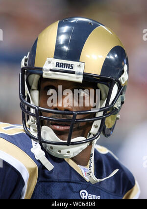 Former St. Louis Rams Isaac Bruce holds the Super Bowl trophy during  ceremonies celebrating the teams Super Bowl victory in the 1999-2000  season, at the Edward Jones Dome during half time of