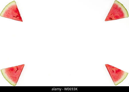 Triangular isolated slices of watermelon forming geometric games for copy space on a white background Stock Photo