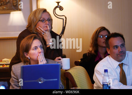 Missouri State Auditor and U.S. Senate hopeful Claire McCaskill (standing) watches election returns with staffers from her hotel room in St. Louis on November 7, 2006.  McCaskill, a democrat and incumbent Jim Talent, are locked up in a virtual tie for the seat once held by President Harry Truman. (UPI Photo/Bill Greenblatt) Stock Photo