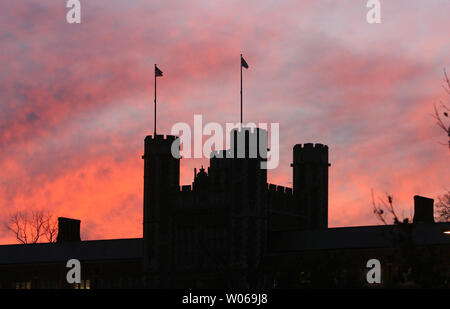 Brookings Hall at Washington University is outlined by a colorful sky during sunset in St. Louis on December 13, 2006. Temperatures reached the mid 60's and forcasters are predicting an above mild temperatures for the area for the rest of the week. (UPI Photo/Bill Greenblatt) Stock Photo